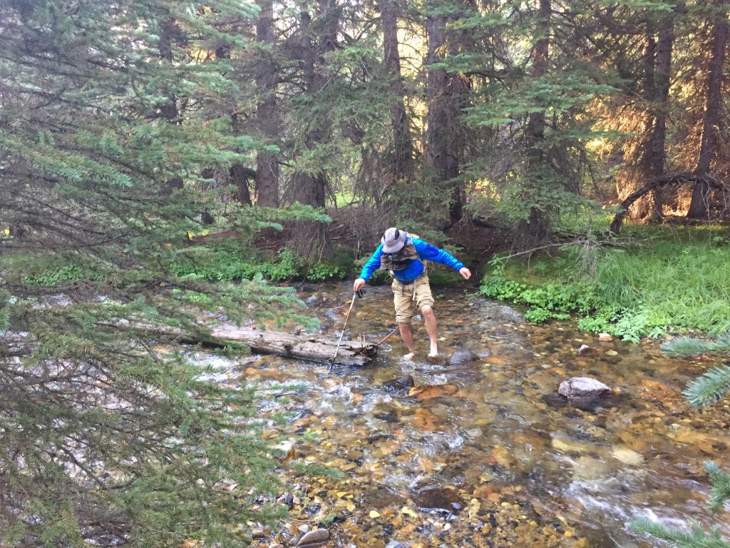Pat wading the creek. 