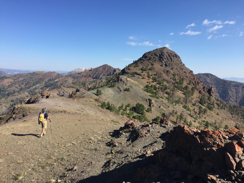 Crossing the summit ridge to the true summit.