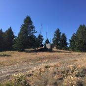 The summit of Cottonwood Butte sits between the buildings in this photo.