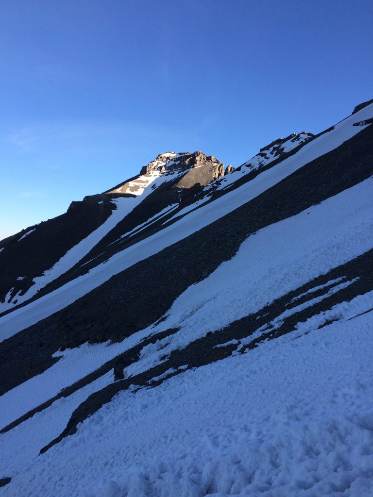 The top of route is in the sunlight/shadow interface. Neil Gleichman Photo