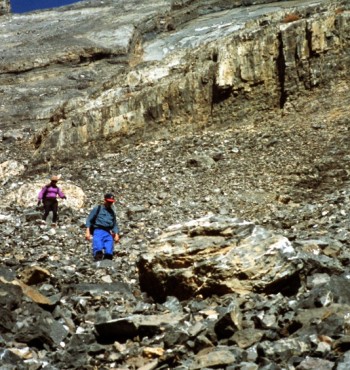 Two climbers descending the lower face. There a number of cliffs to skirt around on this route and enough lose rock to trip any climber up.