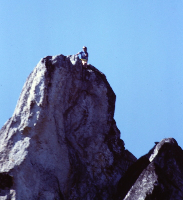 Dana Hansen on the summit. The notch described above is in the lower right hand corner of this shot. The final portion of the climb from the notch to the summit is on the back side of the spire .