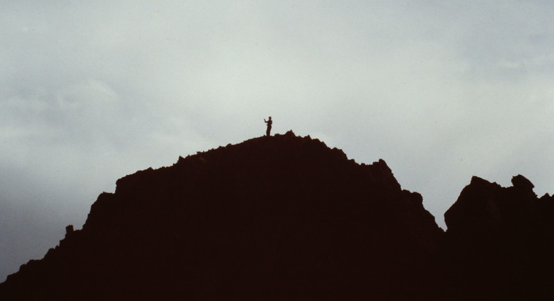 A lone climber on the summit.