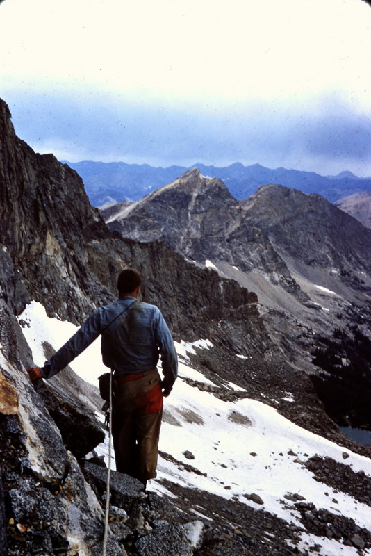 Francis Willmarth surveying an approaching thunderstorm during a 1954 attempt on the north face of Goat Mountain. Evilio Echevarria Photo