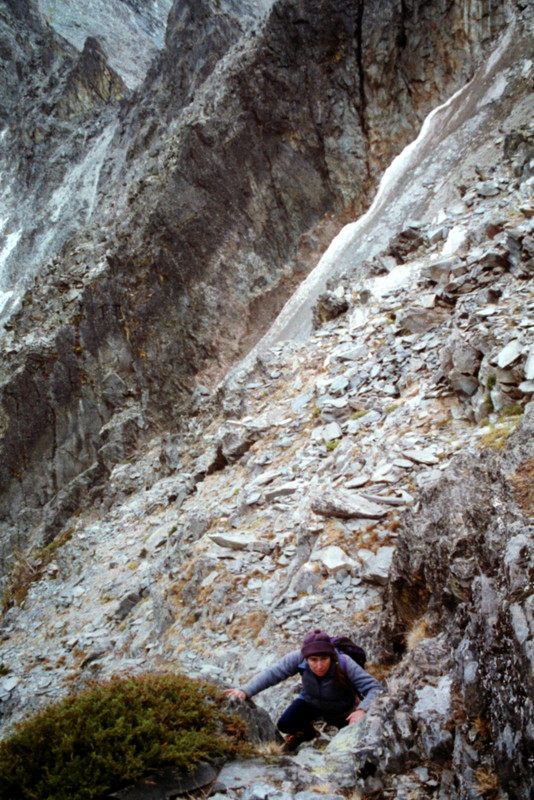 Dana Hansen climbing out of the gully at the top of the cirque and onto the face.