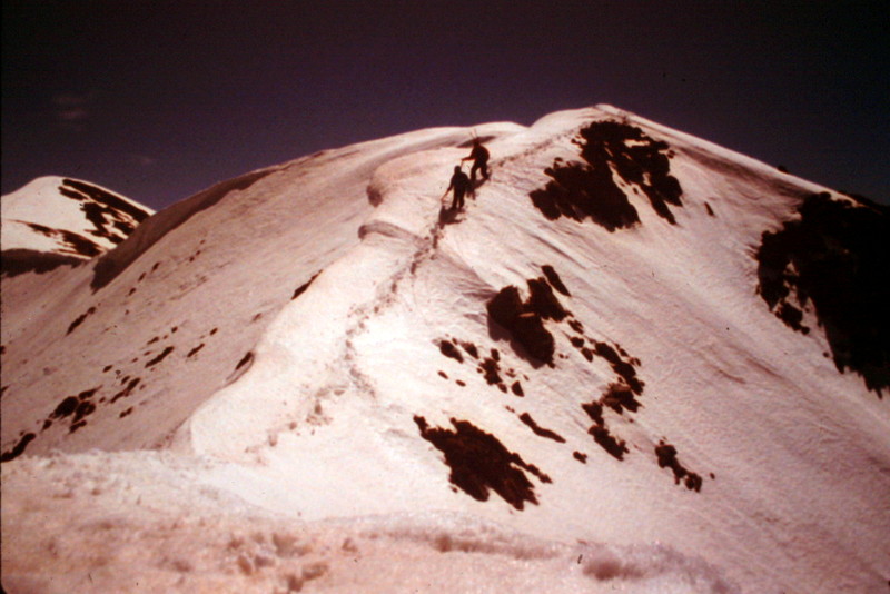 Climbers traversing the summit ridge between the Middle and true summit.