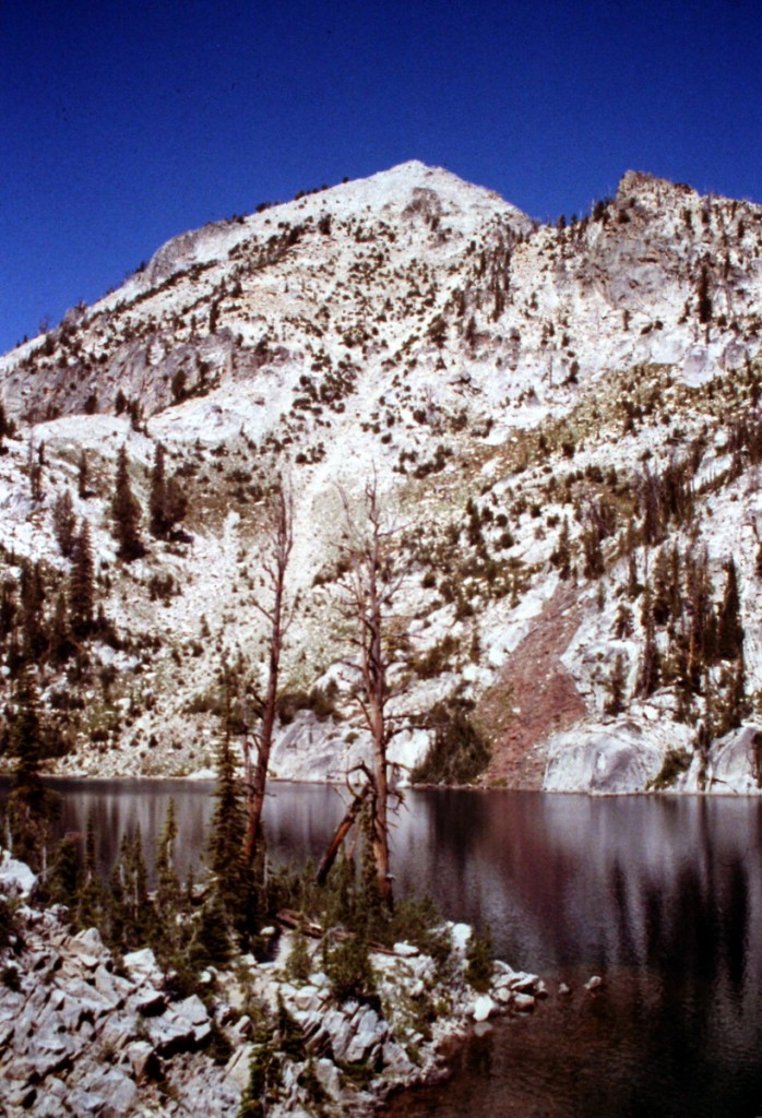 The east face of Mount Everly rising up above Everly Lake. The standard route climbs up this face.