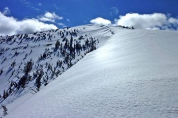 The Crescent: a large semi-circular snow heap visible on Snow Peak until mid-summer. Scot Kelchner photo.