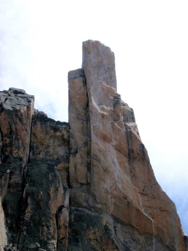View of west-side of North Raker. The original Becky-Schoening route easily goes to the left-hand summit, then aid-climbs rotten-rock to the right-hand summit. From the description they likely went up the large crack. Ray Brooks Photo