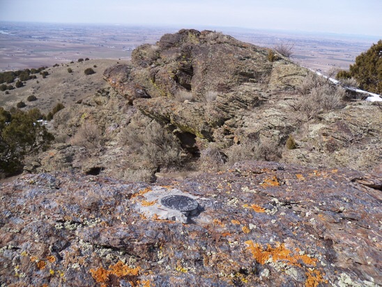 Summit view NW to Snake River and the Burley area, 3/5/13. In place, a US Coast & Geodetic Survey benchmark tablet stamped 'Declo' and dated 1950. On the side of this mountain overlooking Declo High School is a large painted letter 'D'. Rick Baugher Photo 