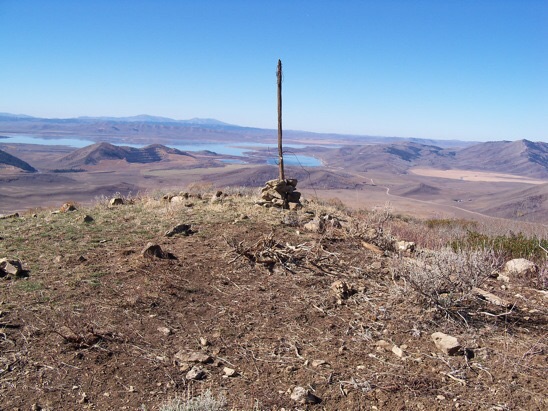 On top, a USGS benchmark tablet stamped 'Enoch' and dated 1948. View W to Blackfoot Reservoir and the Putnams, 10/24/13. Rick Baugher Photo