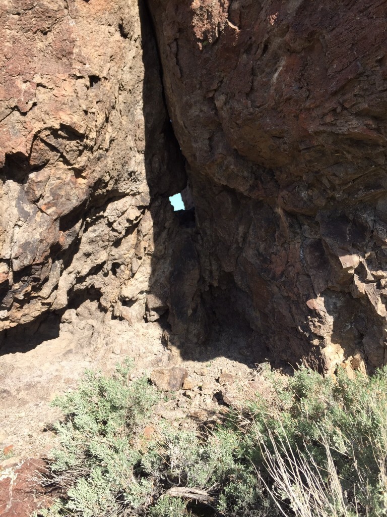 A tiny window forming in a rock formation on the west ridge.