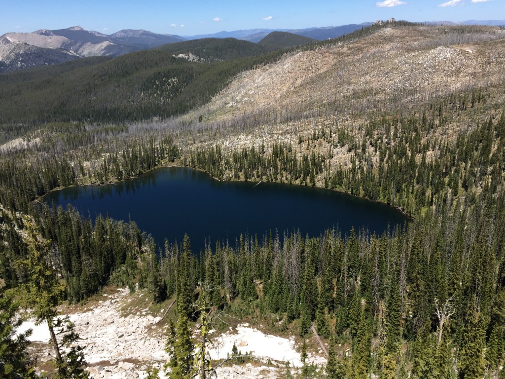 Summit lake sits below Diamond Rock. The route to the summit from the lake climbs up the burned slopes to the right of the lake. 