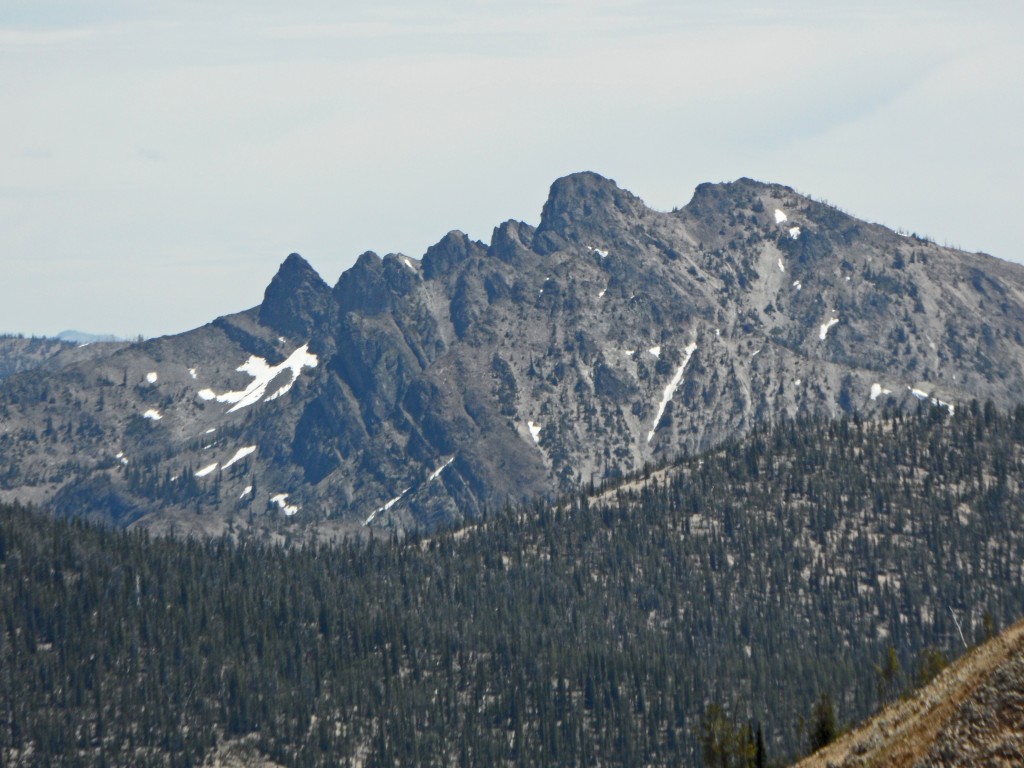Pinnacles Peak viewed from Crater Peak. The route follow climbs to the saddle between the two points on the right and the climbs the east side of the summit block. John Platt Photo 
