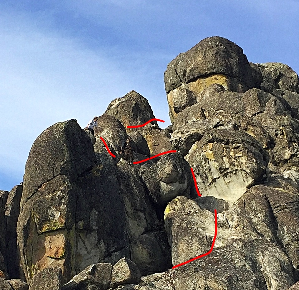 The fourth section climbs the crack between the bulging Boulder and the east wall. It then follows the line shown here to the notch.