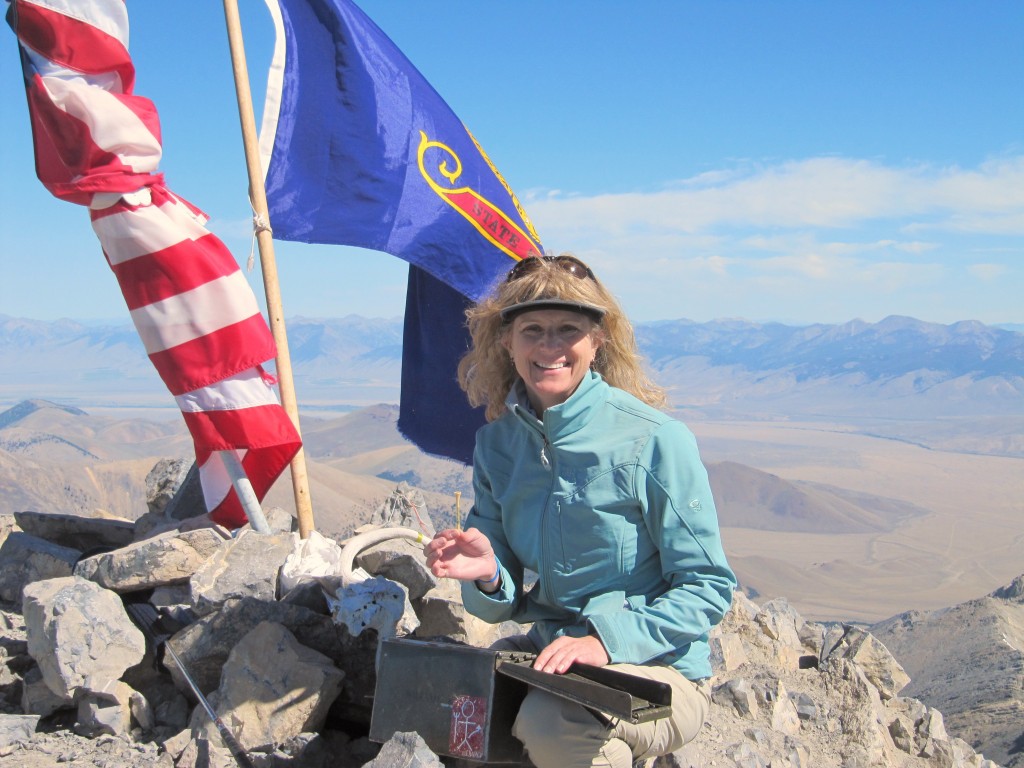 During July and August you are bound to find other climbers on Borah and often a festive atmosphere on the summit. Margo Mandella on the summit. Photo - Dave Pacioretty