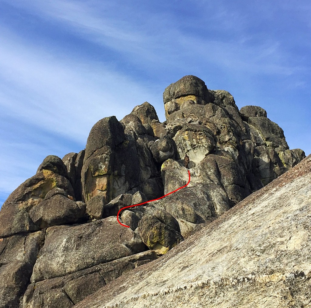 The third section of the route climbs up, first to the right, then back to the base of the large bulging rock shown here.