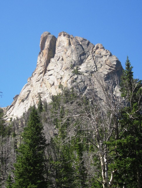  The largest of the granite towers below White Knob Peak. The rock looks clean & good & appears to have at least one crack-line from bottom to top, that ends in the huge dihedral near top center of the tower. That will likely end in a large chimney. Ray Brooks Photo 