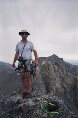 Brian on the summit with East Tower in the background.